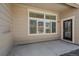 Exterior patio with a large set of windows and an exterior door at 12255 Hazel Spruce Ct, Parker, CO 80134