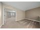 Upper level hallway leading to bedrooms with neutral wall tones and carpet at 12255 Hazel Spruce Ct, Parker, CO 80134