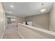 Upstairs hallway leading to bedrooms with carpet flooring at 12255 Hazel Spruce Ct, Parker, CO 80134