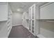 Large walk-in closet with ample shelving and hanging space at 12255 Hazel Spruce Ct, Parker, CO 80134