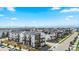 A neighborhood featuring modern townhomes with solar panels and mountain views at 16637 Shoshone St, Broomfield, CO 80023