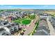 A neighborhood featuring modern townhomes with a green park area and scenic views at 16637 Shoshone St, Broomfield, CO 80023