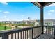 Balcony view of community, showing manicured lawns and residential street with parking at 16637 Shoshone St, Broomfield, CO 80023