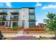 A modern townhome with a balcony and beautiful landscaping at 16637 Shoshone St, Broomfield, CO 80023