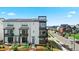 Modern townhome with solar panels, balcony, and manicured front yard at 16637 Shoshone St, Broomfield, CO 80023
