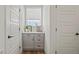 Bright hallway with a built-in storage unit and stylish decor near the front entry at 16637 Shoshone St, Broomfield, CO 80023