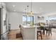 A modern kitchen with stainless steel appliances, island, and eat in dining area at 16637 Shoshone St, Broomfield, CO 80023