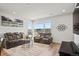 Inviting living room with plush seating, modern decor, and plenty of natural light at 16637 Shoshone St, Broomfield, CO 80023