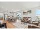 Open-concept living space with modern seating, dining area, and a view into the kitchen at 16637 Shoshone St, Broomfield, CO 80023