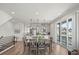 Open living space with a modern kitchen, dining area, and sliding glass doors to balcony at 16637 Shoshone St, Broomfield, CO 80023