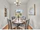 Bright dining room features a round table, four chairs, and a large window with natural light at 3372 Central Park Blvd, Denver, CO 80238