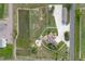 Aerial view of the property featuring a home, multi-car garage, playground and a large pond at 2370 W 152Nd Ave, Broomfield, CO 80023