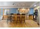 Open concept bar featuring stainless steel appliances and a view of the main living space at 2370 W 152Nd Ave, Broomfield, CO 80023