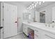 Modern bathroom featuring a double vanity, decorative lighting, tile floors, and neutral wall color at 2370 W 152Nd Ave, Broomfield, CO 80023