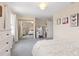 Spacious bedroom featuring a mirrored closet, plush carpet, and a vanity area with ample lighting at 2370 W 152Nd Ave, Broomfield, CO 80023