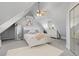 Well-lit bedroom featuring an angled ceiling, plush carpet, a ceiling fan, and ample natural light at 2370 W 152Nd Ave, Broomfield, CO 80023