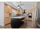 Modern kitchen with custom wood cabinets, stainless steel appliances, and a center island with seating at 2370 W 152Nd Ave, Broomfield, CO 80023