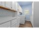 Bright laundry room with white cabinets, countertop space, and washer and dryer at 2370 W 152Nd Ave, Broomfield, CO 80023