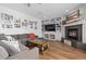 Cozy living room featuring a fireplace, hardwood floors, and comfortable seating at 2370 W 152Nd Ave, Broomfield, CO 80023