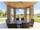 Covered outdoor seating area with stone columns and views of the property at 2370 W 152Nd Ave, Broomfield, CO 80023