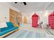 Spacious room with a sauna, a striped play canopy, carpeting, a sofa, and a large mirrored wall at 2370 W 152Nd Ave, Broomfield, CO 80023