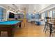 Recreation room features a pool table, bar seating, and a comfortable lounge area, perfect for entertainment and relaxation at 2370 W 152Nd Ave, Broomfield, CO 80023