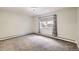 Neutral bedroom featuring carpet and a window at 3124 S Wheeling Way # 102, Aurora, CO 80014