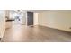 Open living space with modern flooring connecting to a well-equipped kitchen with white appliances at 3124 S Wheeling Way # 102, Aurora, CO 80014