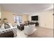 Cozy living room with natural light, neutral decor, sliding door and modern furnishings at 3124 S Wheeling Way # 102, Aurora, CO 80014