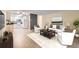 Bright open floorplan featuring updated kitchen, modern furniture, and a cozy living space at 3124 S Wheeling Way # 102, Aurora, CO 80014