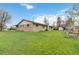 Expansive backyard with a shed, garden and brick house at 6288 S Harlan Way, Littleton, CO 80123