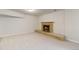 Finished basement with a brick fireplace and hearth, new carpet, and painted walls at 6288 S Harlan Way, Littleton, CO 80123