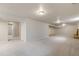 Spacious carpeted basement with recessed lighting and white painted walls at 6288 S Harlan Way, Littleton, CO 80123