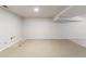 Unfinished basement with tiled flooring, recessed lights, and open layout at 6288 S Harlan Way, Littleton, CO 80123