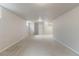 Large finished basement area with neutral carpet, recessed lighting, and window at 6288 S Harlan Way, Littleton, CO 80123