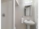 Bright bathroom features a pedestal sink and walk-in shower at 6288 S Harlan Way, Littleton, CO 80123