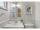 Bathroom with vanity, commode, upgraded mirror, lighting, and hardware at 6288 S Harlan Way, Littleton, CO 80123