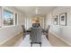 Dining room with large windows and an open entryway at 6288 S Harlan Way, Littleton, CO 80123