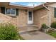 Close-up of the front door, showcasing brick accents, planter, and the house number 6288 at 6288 S Harlan Way, Littleton, CO 80123