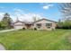 Charming brick home with a lush green lawn, attached garage, and inviting curb appeal at 6288 S Harlan Way, Littleton, CO 80123