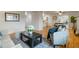 Open living room space with hardwood floors, stylish seating, and seamless flow to other areas at 6288 S Harlan Way, Littleton, CO 80123