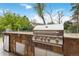 A stainless steel grill is the centerpiece of the outdoor kitchen at 6288 S Harlan Way, Littleton, CO 80123