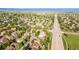 Wide aerial perspective of a suburban neighborhood showcasing a mix of homes and roadways at 10581 Pearlwood Cir, Highlands Ranch, CO 80126