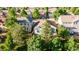 Residential single Gathering home nestled in a neighborhood with mature trees and manicured lawns at 10581 Pearlwood Cir, Highlands Ranch, CO 80126