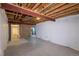 Unfinished basement with exposed beams and vapor barrier on the walls provides ample room for future expansion or storage at 10581 Pearlwood Cir, Highlands Ranch, CO 80126
