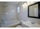 Well-maintained bathroom features a bathtub, tiled walls, and vanity sink at 10581 Pearlwood Cir, Highlands Ranch, CO 80126