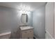 Bathroom featuring granite vanity with storage, modern lighting, and updated fixtures creates a stylish retreat at 10581 Pearlwood Cir, Highlands Ranch, CO 80126