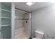Bathroom features tiled shower, open shelving, and modern fixtures combines functionality with updated style at 10581 Pearlwood Cir, Highlands Ranch, CO 80126