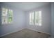 Neutral bedroom with carpet, windows with shutters providing natural light and privacy at 10581 Pearlwood Cir, Highlands Ranch, CO 80126