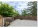 An outdoor deck offers a great area to relax, admire the view, and enjoy a private backyard surrounded by mature trees at 10581 Pearlwood Cir, Highlands Ranch, CO 80126